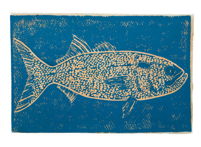 Print of a yellow bluefish on a blue background.