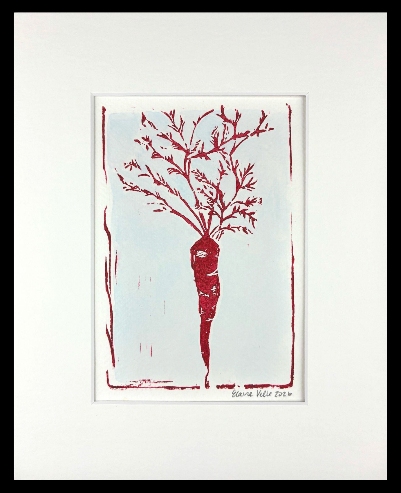 A framed art print featuring a minimalist red drawing of a carrot with leafy roots on a white background, surrounded by a wide white mat and a black frame.