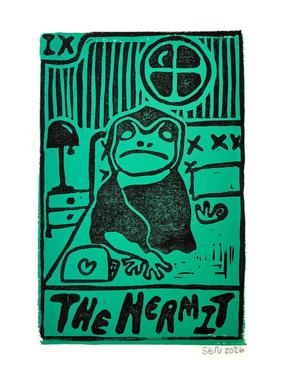 A square art print featuring a stylized black ink illustration of a hermit frog on a bright green background, with the text 'THE HERMIT' at the bottom and an artist signature 'SOU 2026' in the lower right corner.