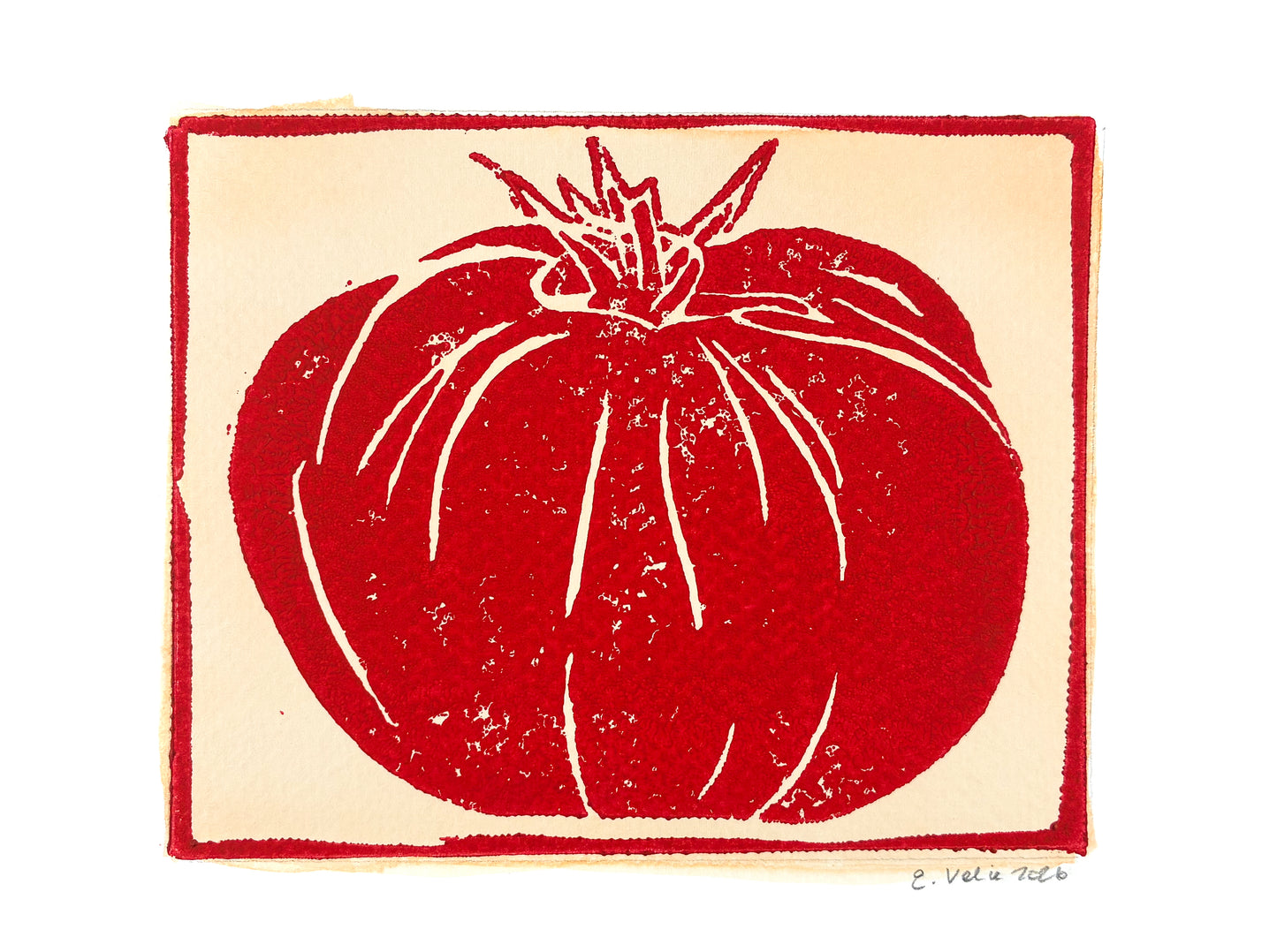 A square art print featuring a stylized red tomato illustration on a cream background, bordered by a red frame-like outline, with a small artist signature at the bottom right.
