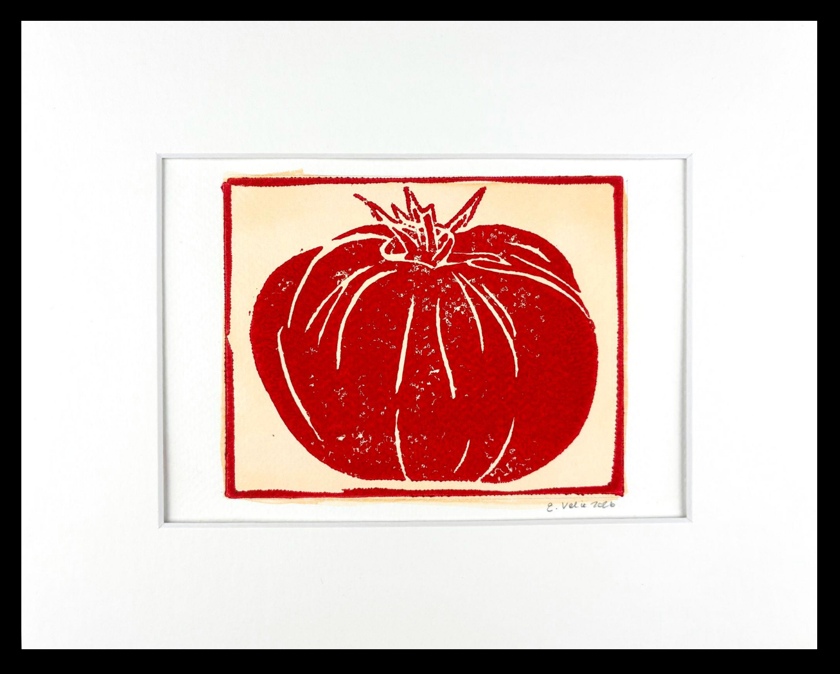 A framed art print featuring a red tomato illustration on a cream background, surrounded by a wide white mat and a black frame.